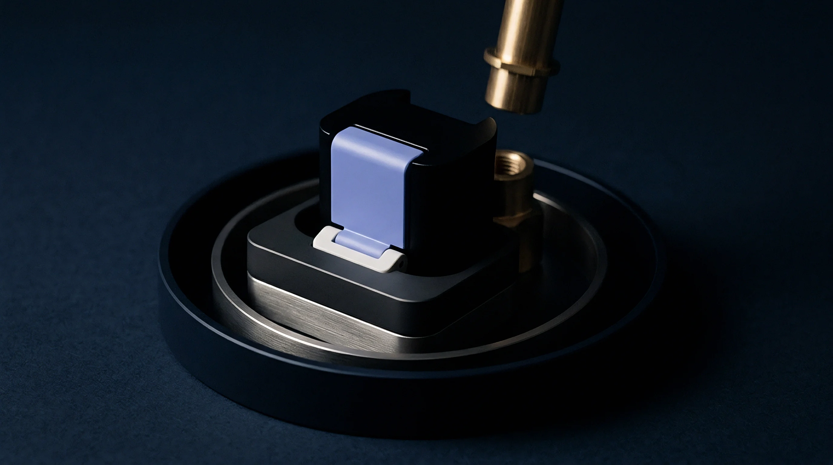 A precision machined metallic housing secures a dark polymer energy storage cell with a purple locking latch next to a threaded brass connector.