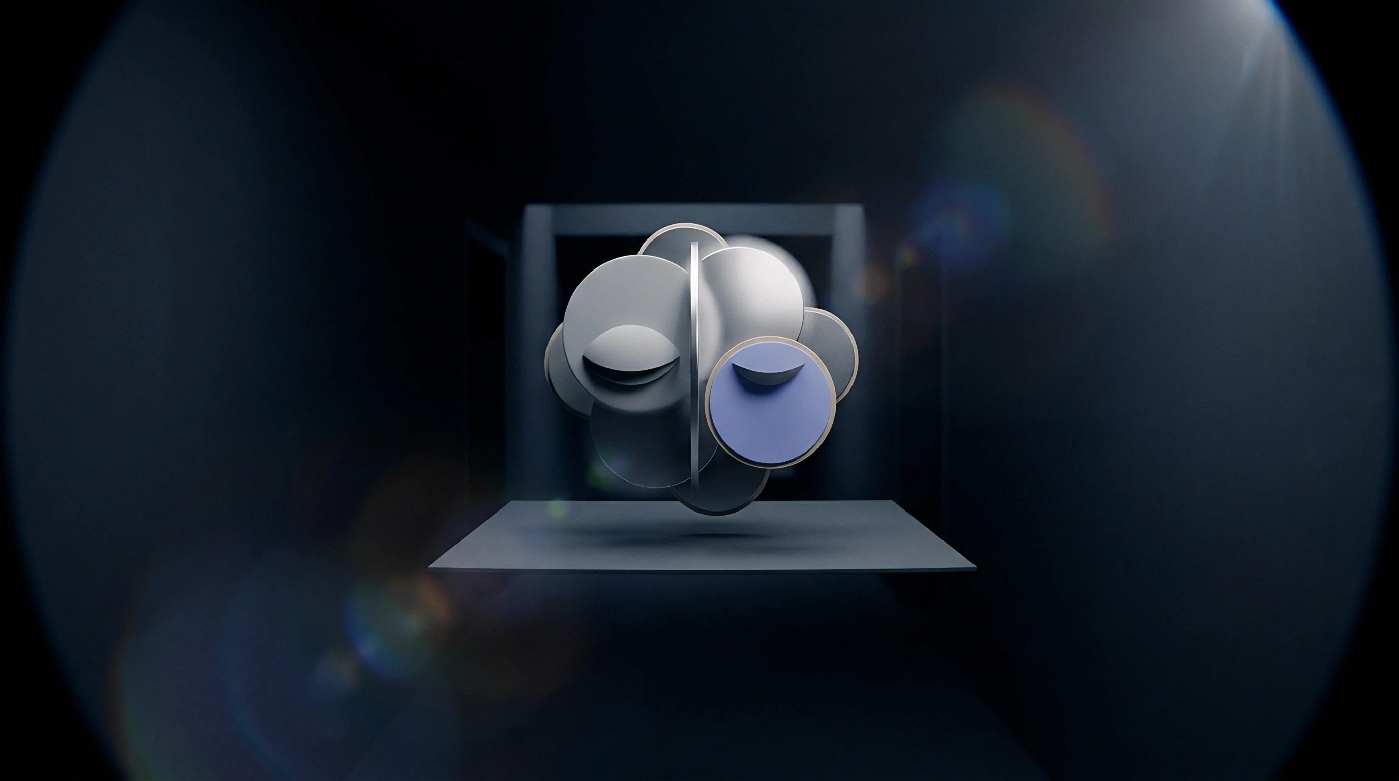 A metallic grey modular structure formed of spherical components rests on a flat platform within a dark high contrast technological environment.