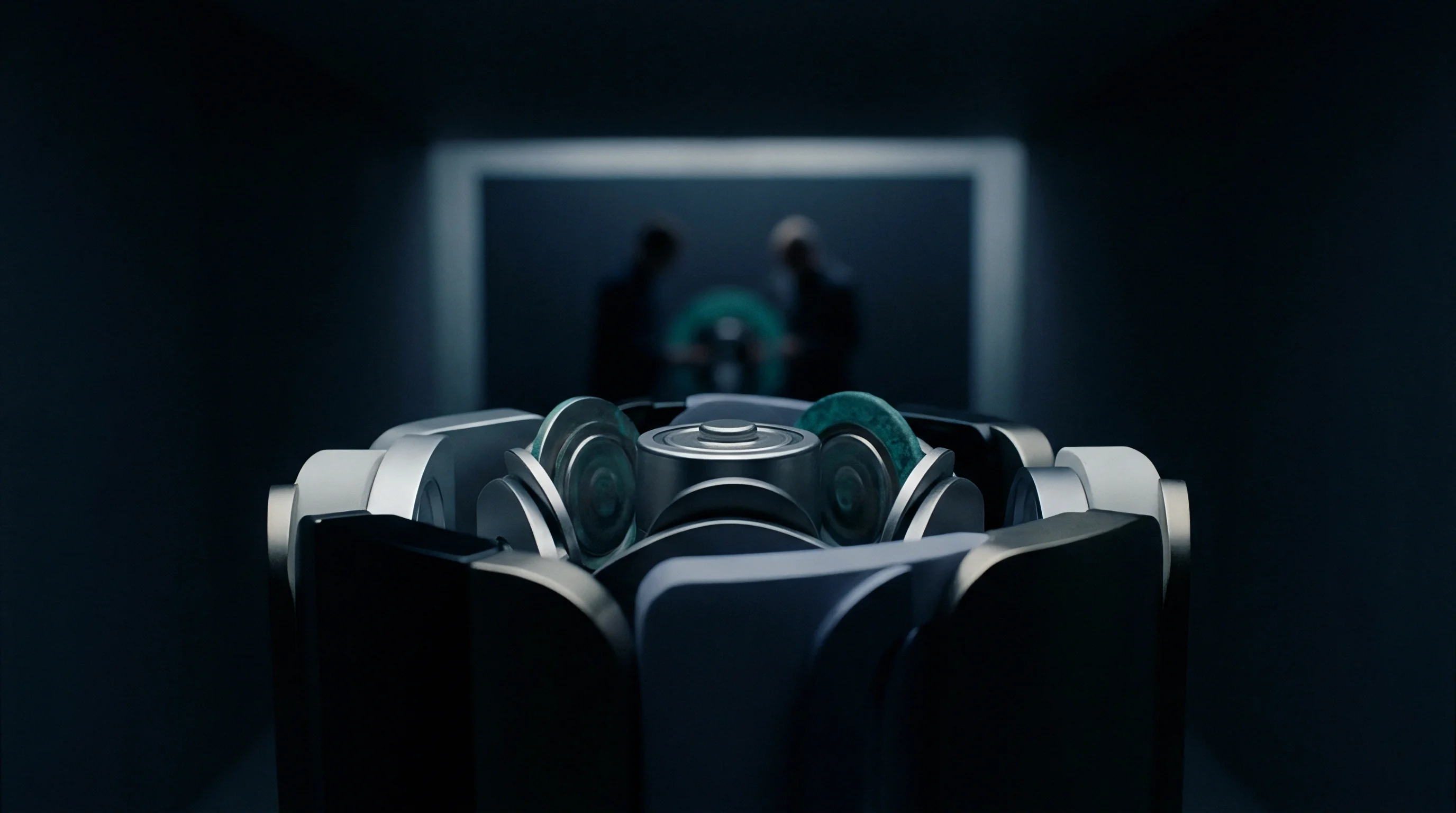 This render shows a complex precision automated assembly mechanism for cylindrical battery cells within a dark advanced technology manufacturing environment.